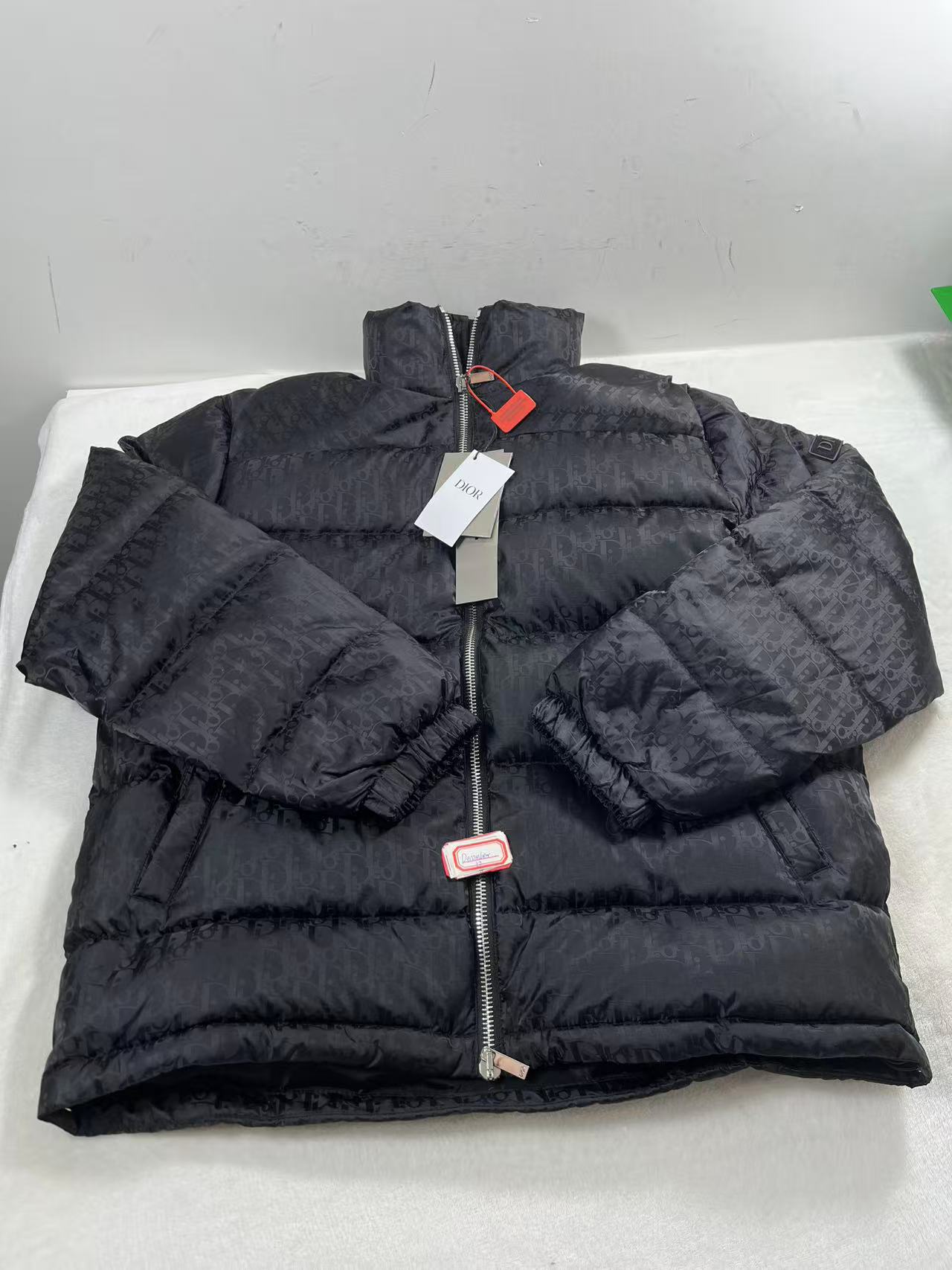 Dior Oblique down jacket in black technical jacquard with a stand collar