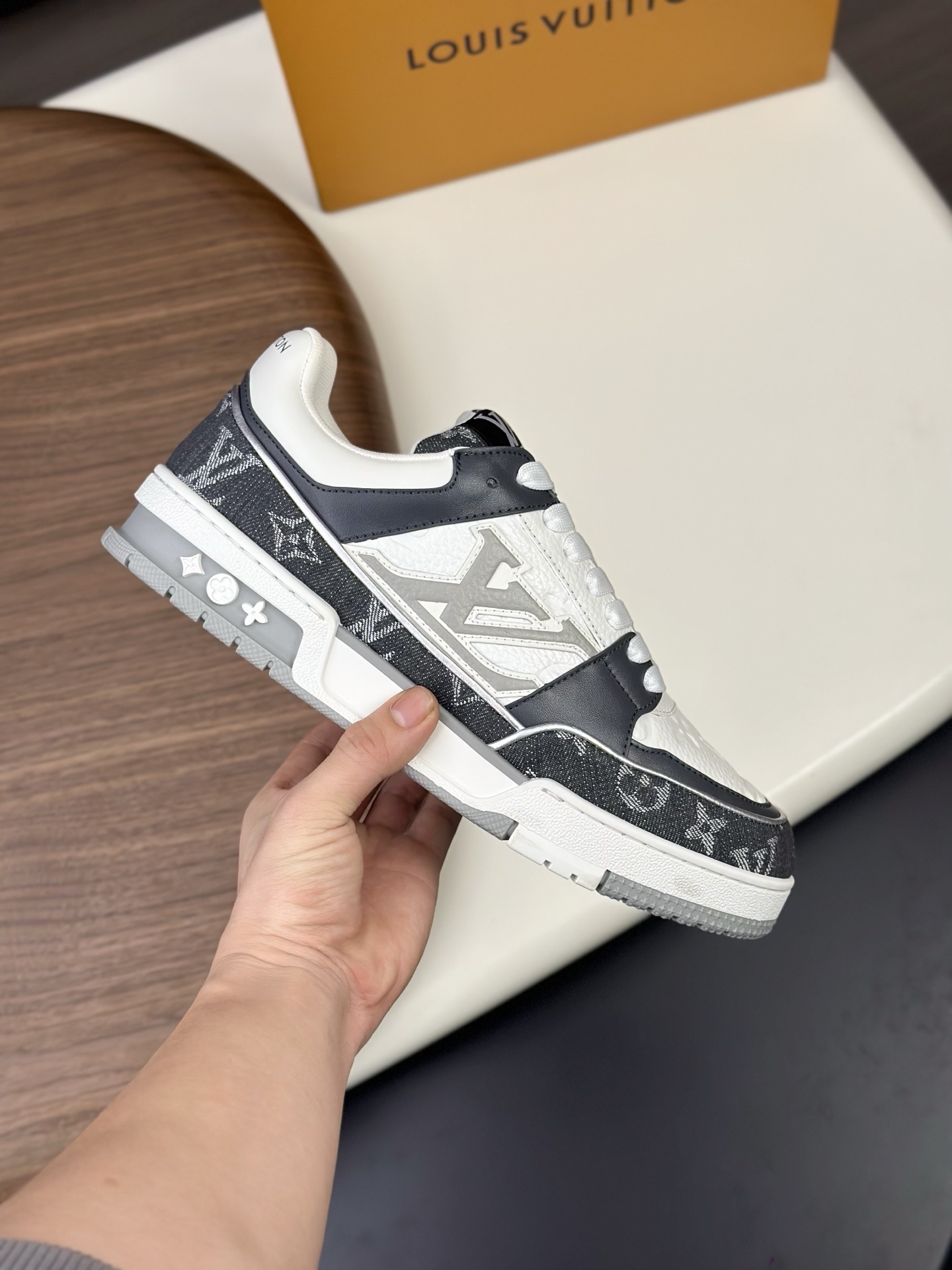 LV Trainer sneaker in Monogram denim and Monogram-embossed grained calf leather
