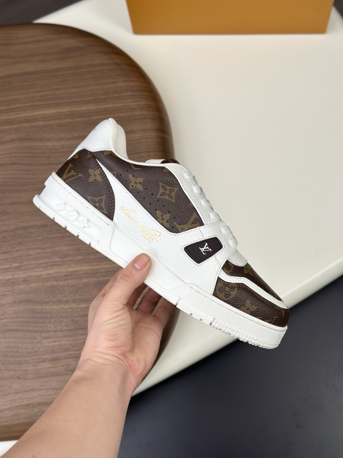 LV Trainer sneaker in a white and brown Monogram print