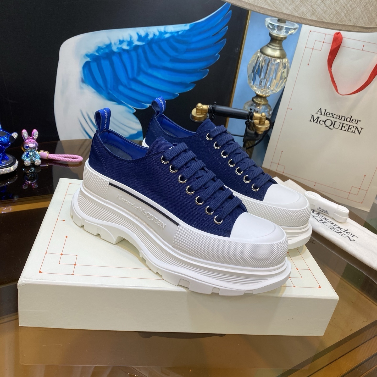 Alexander McQueen Tread Slick low-top sneaker in navy blue canvas and white rubber