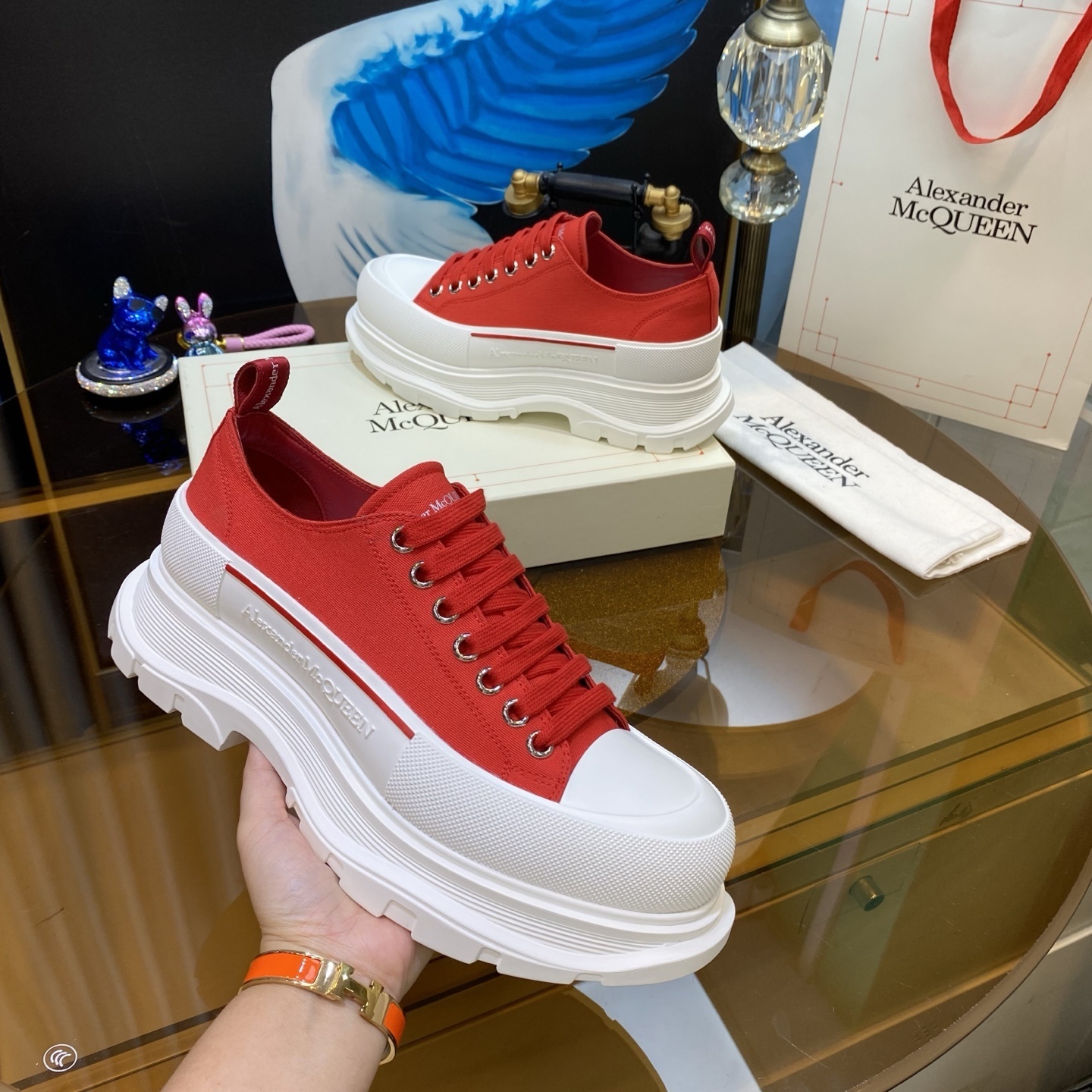 Alexander McQueen Tread Slick low-top canvas platform sneakers in white and red