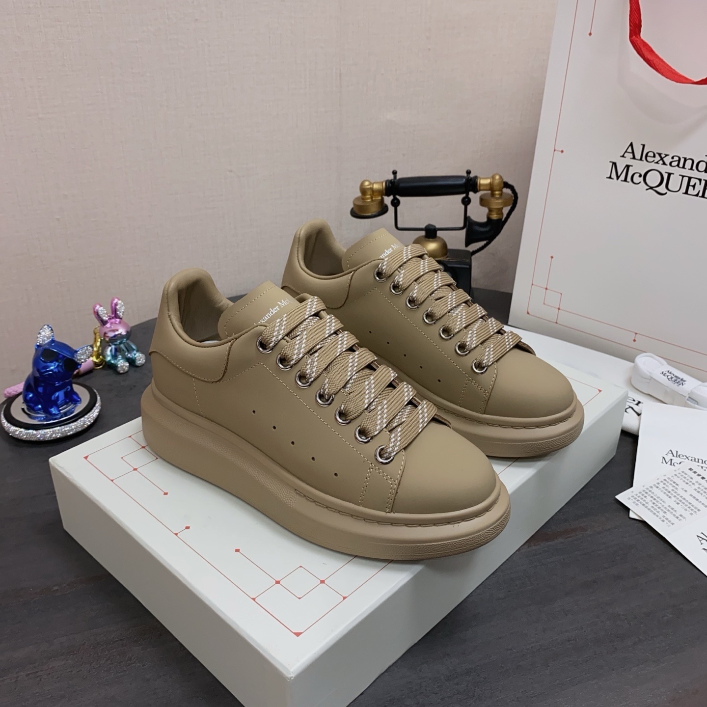 Alexander McQueen Oversized Sneakers in a beige or taupe color with patterned laces