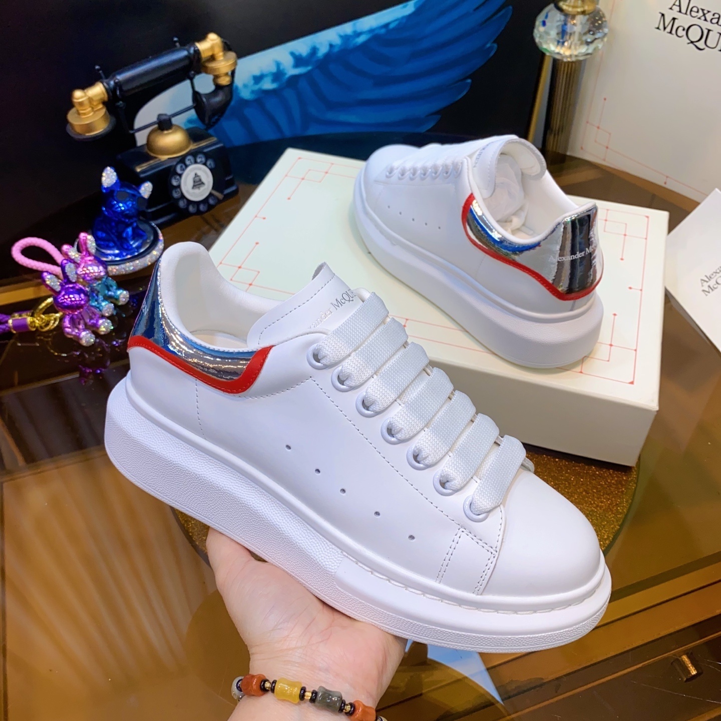 Alexander McQueen Oversized Sneaker in white leather with a silver and Welsh red heel tab