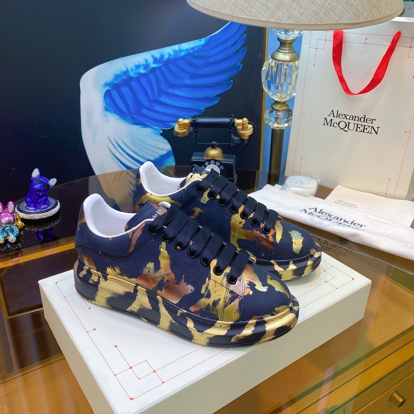 Alexander McQueen Oversized Sneaker with a navy blue and metallic gold camouflage-style print