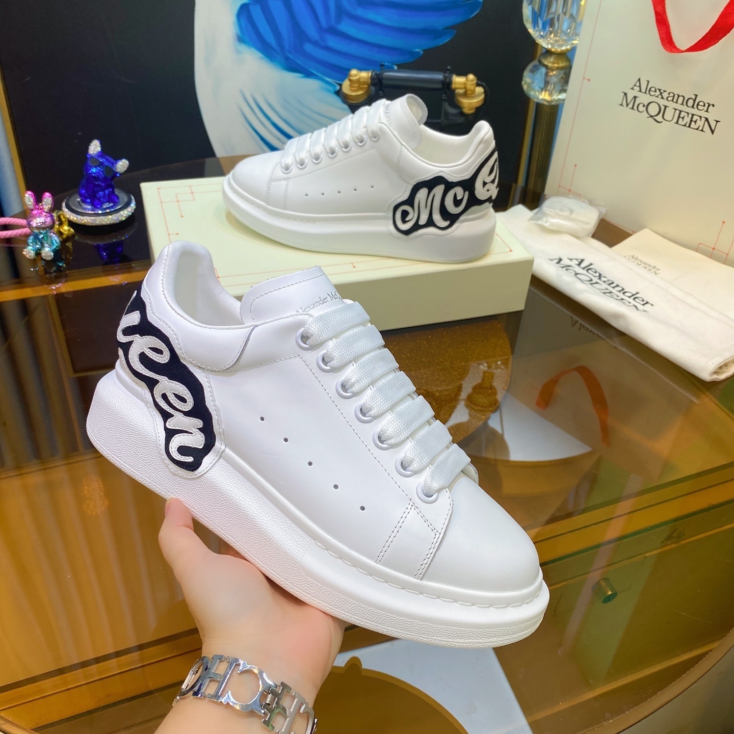 Alexander McQueen Oversized Sneaker in white leather with a black heel counter featuring the brand's signature logo