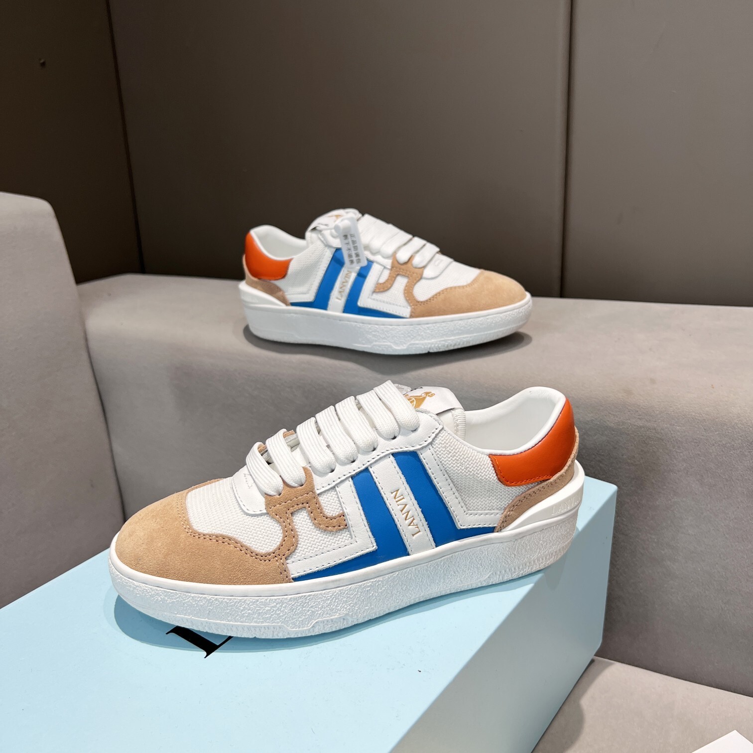 Lanvin Clay Low Top Sneakers in white, blue, and orange suede and leather