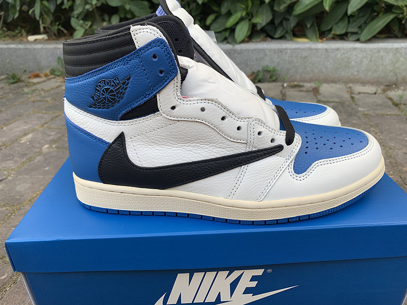 Nike Fragment Design x Travis Scott x Air Jordan 1 Retro High sneaker in a white, black, and military blue colorway