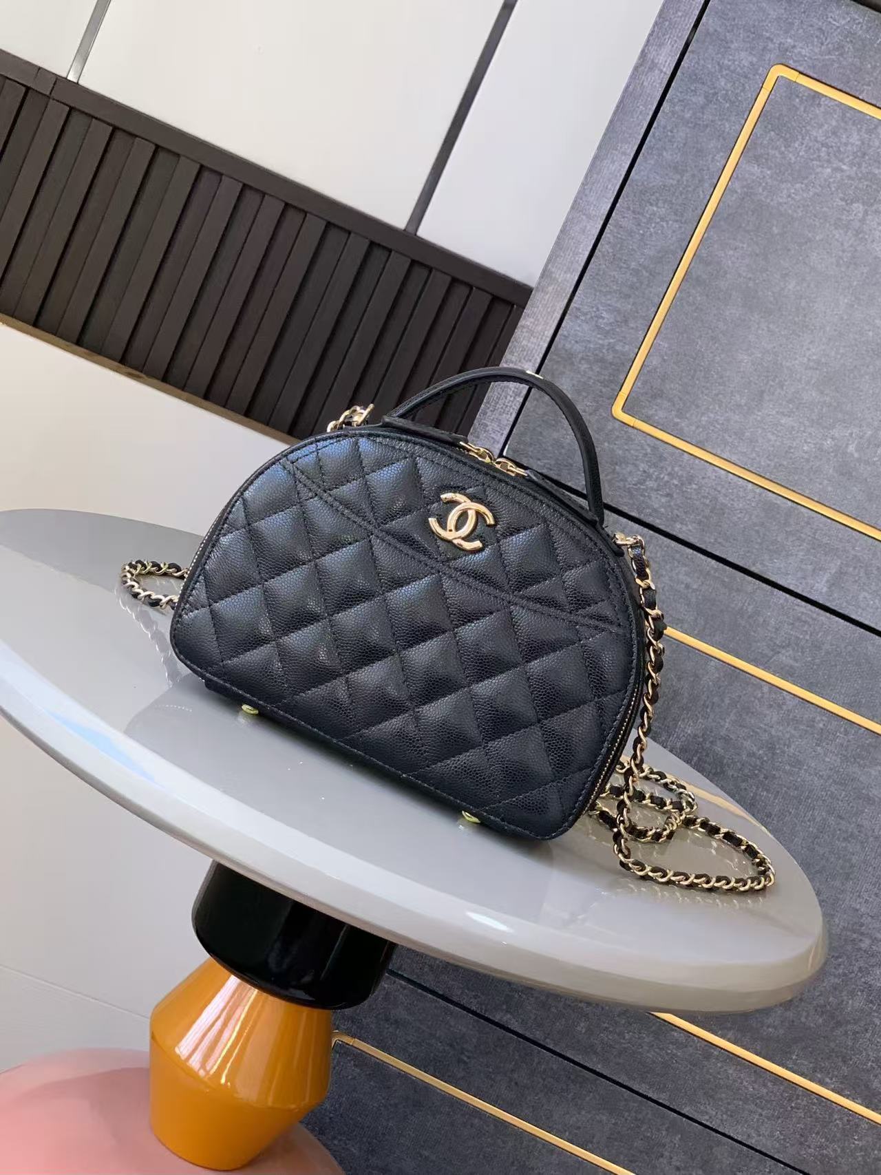 Chanel lambskin quilted Chic Riviera top handle vanity case in black with gold-tone hardware
