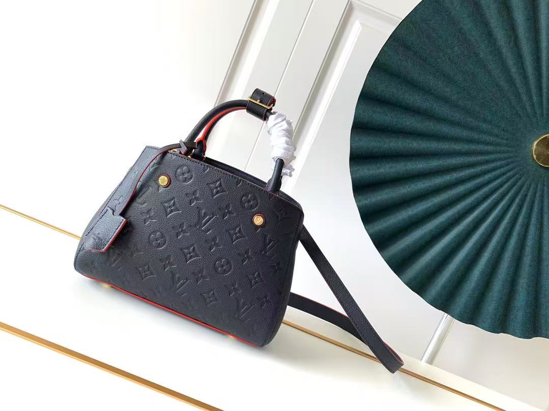 LV Montaigne BB bag in Monogram Empreinte leather with a Marine Rouge (dark blue and red) color scheme