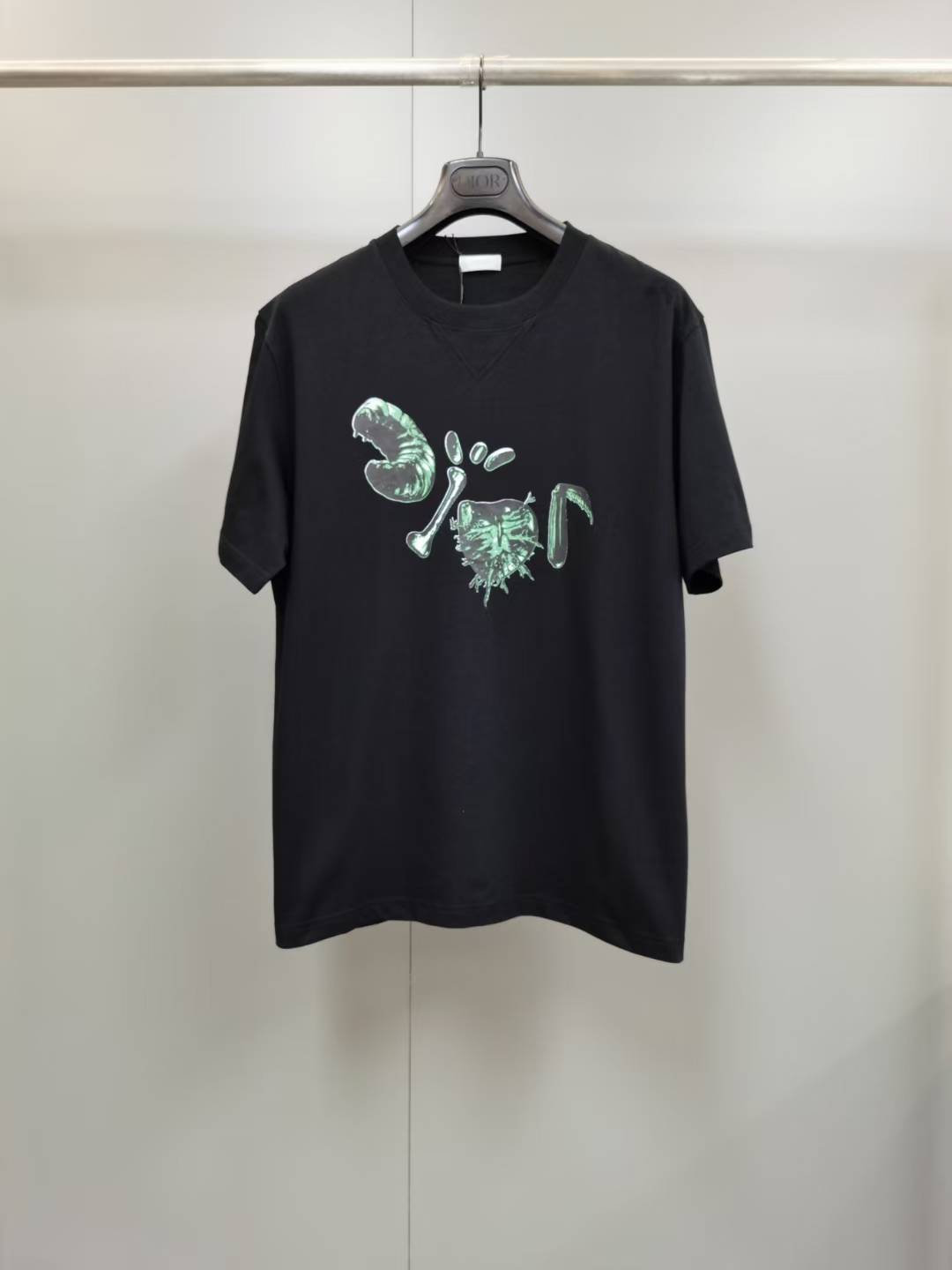 Dior x Cactus Jack Oversized T-shirt in black with a green graphic design