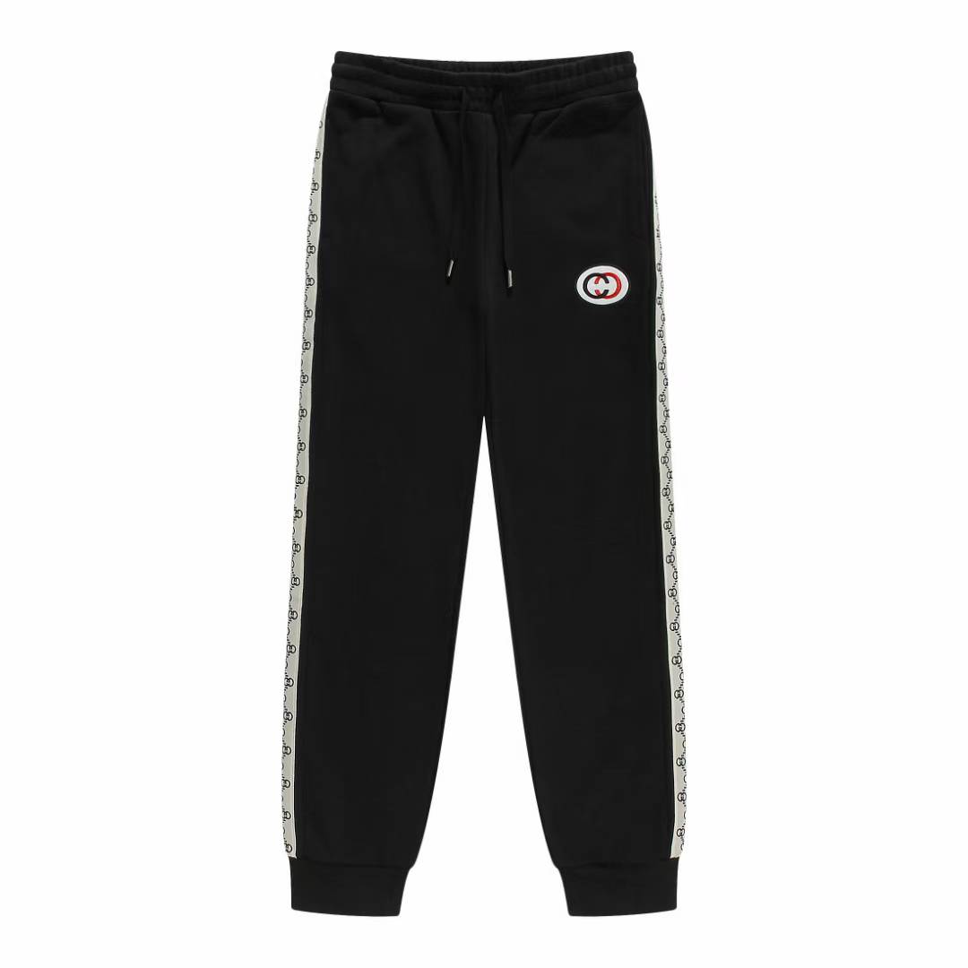 Gucci cotton jersey jogging pants in black with a logo band on the side