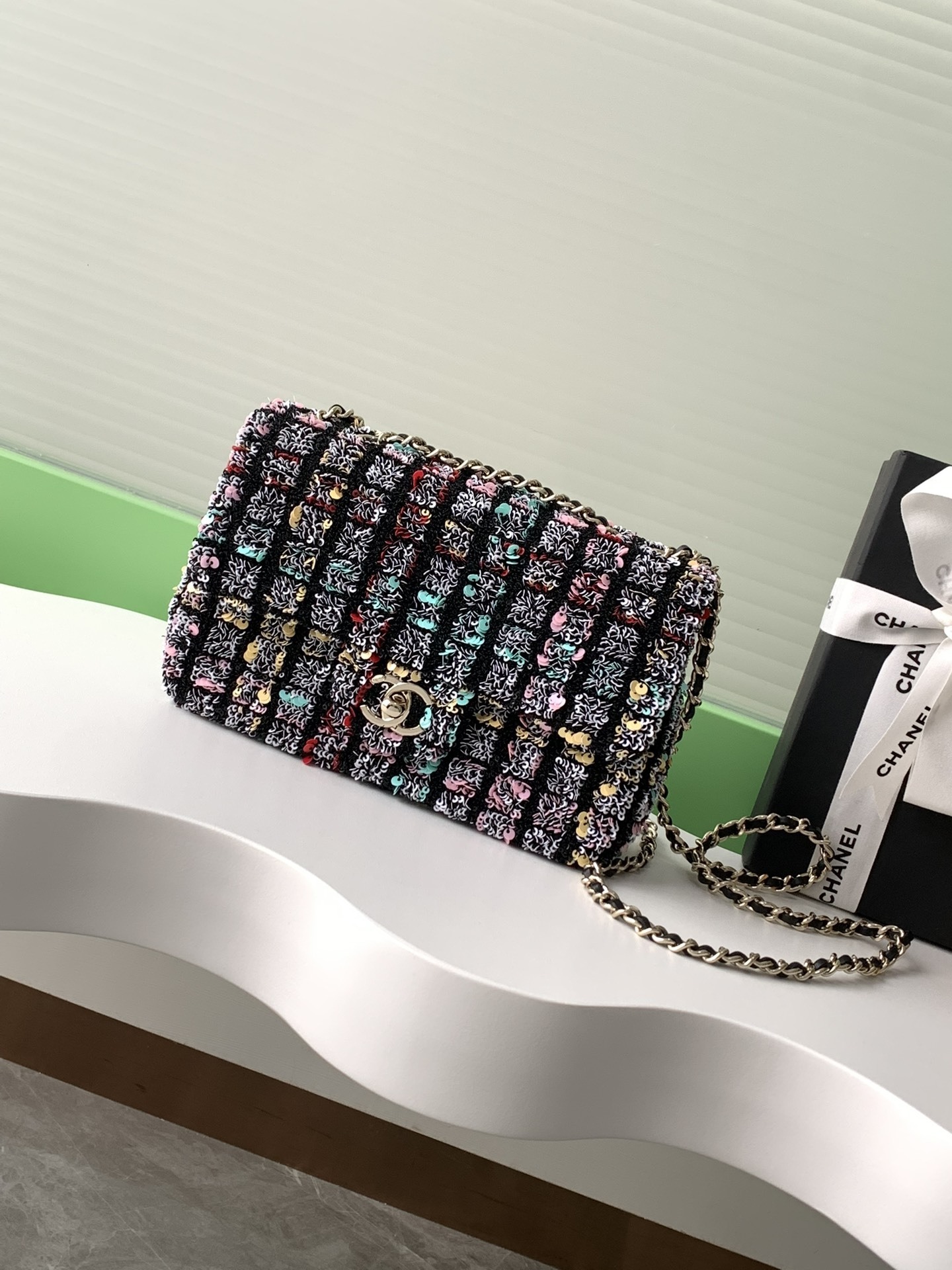 Chanel small classic handbag in tweed and gold metal