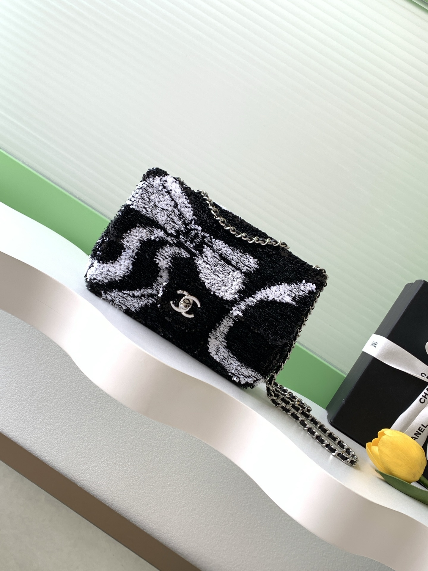 Chanel Sequin Ribbon Mini Rectangular Flap bag in black and white.
