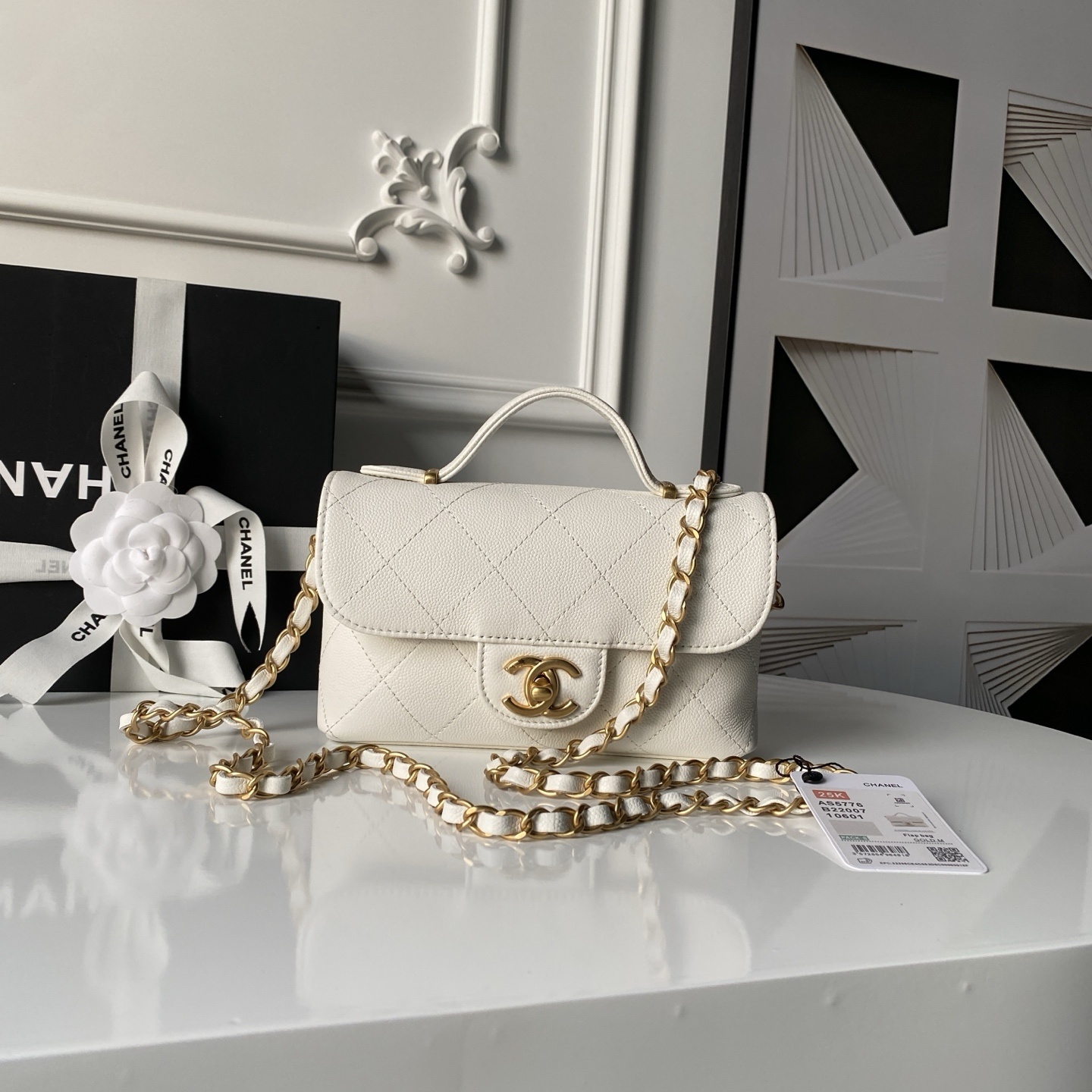 Chanel Caviar Quilted Small Top Handle Flap bag in white with aged gold hardware