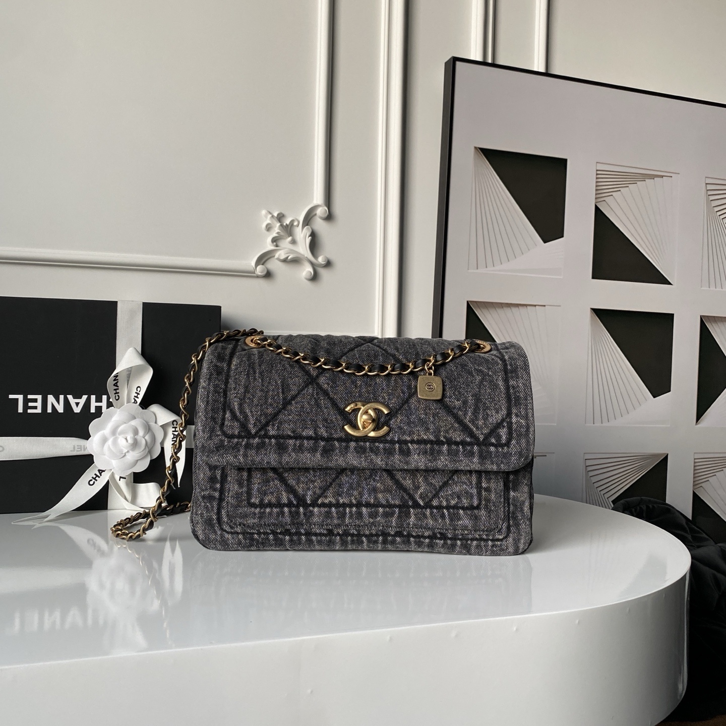 Chanel Matelasse or Classic Flap bag in black washed denim with gold-tone metal hardware