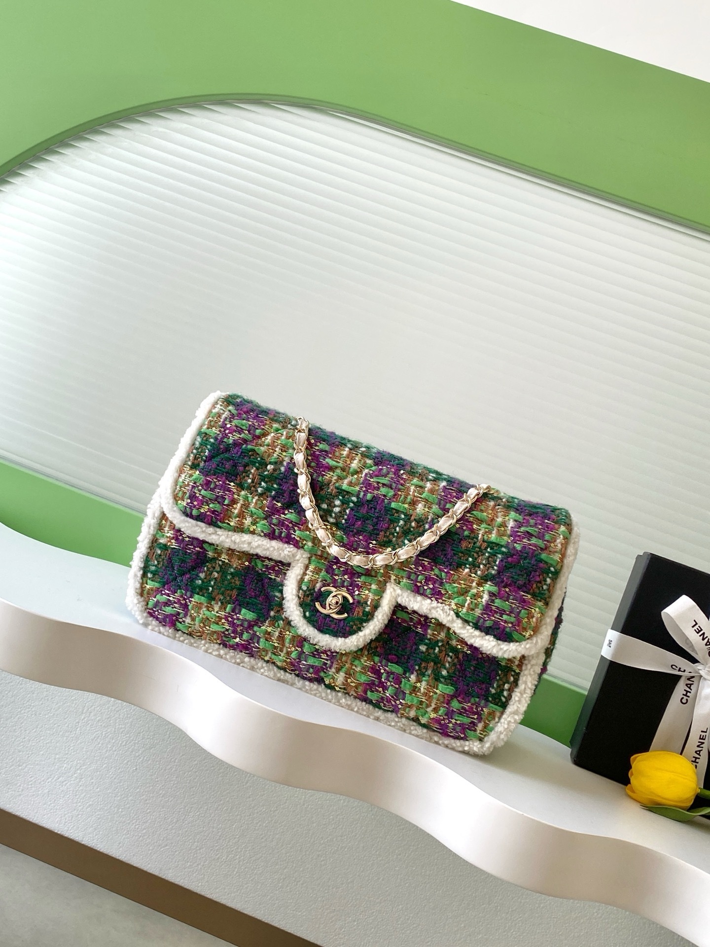 Chanel large flap bag in a multi-color tweed and sheepskin material with gold-tone metal hardware