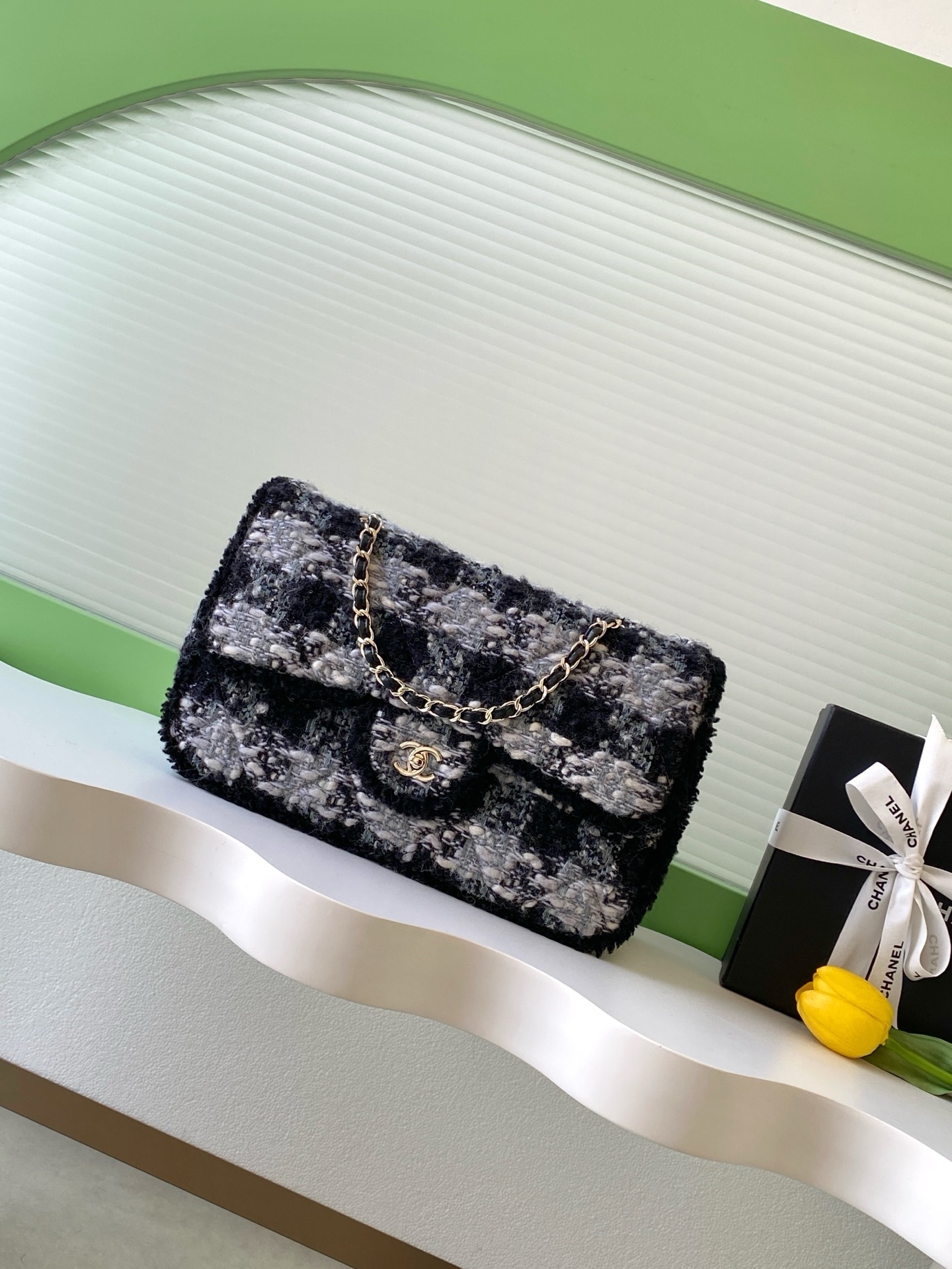 Chanel Classic Flap bag in black and white tweed with gold-tone hardware