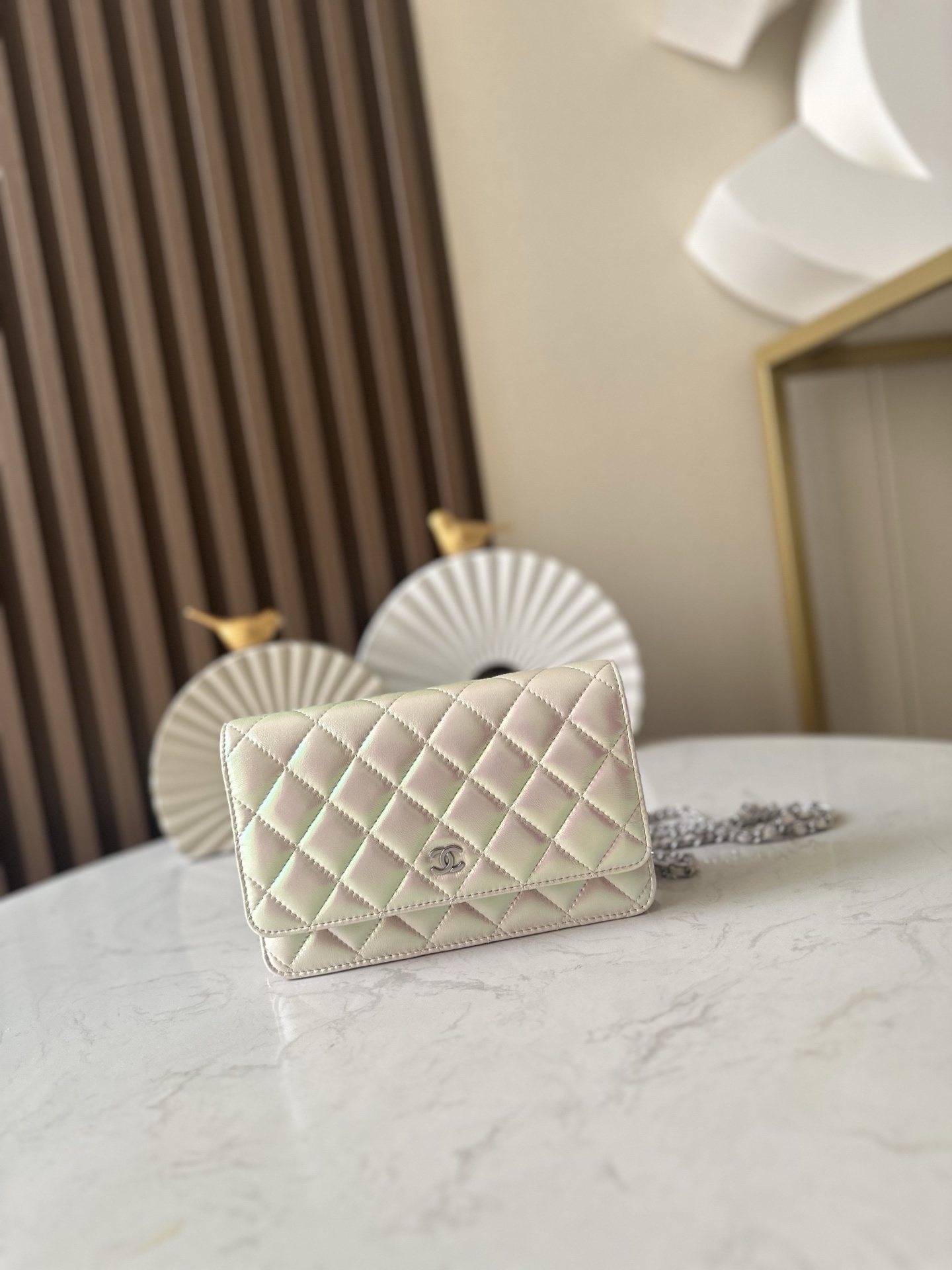 Chanel Wallet on Chain (WOC) in iridescent ivory quilted leather