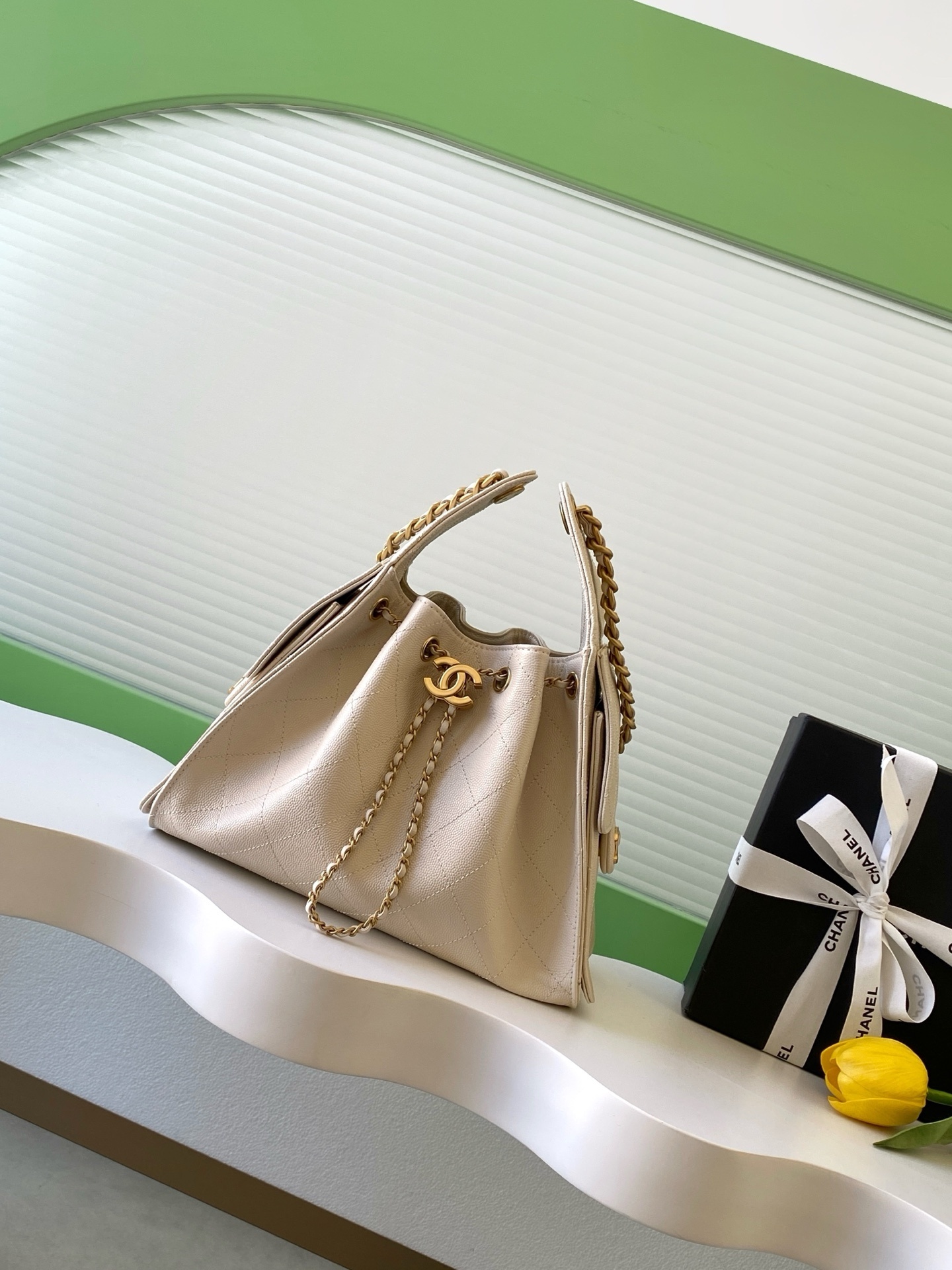 Chanel 25 Hobo Bag in light pale pink/rose clair caviar leather with antique gold-tone metal hardware.