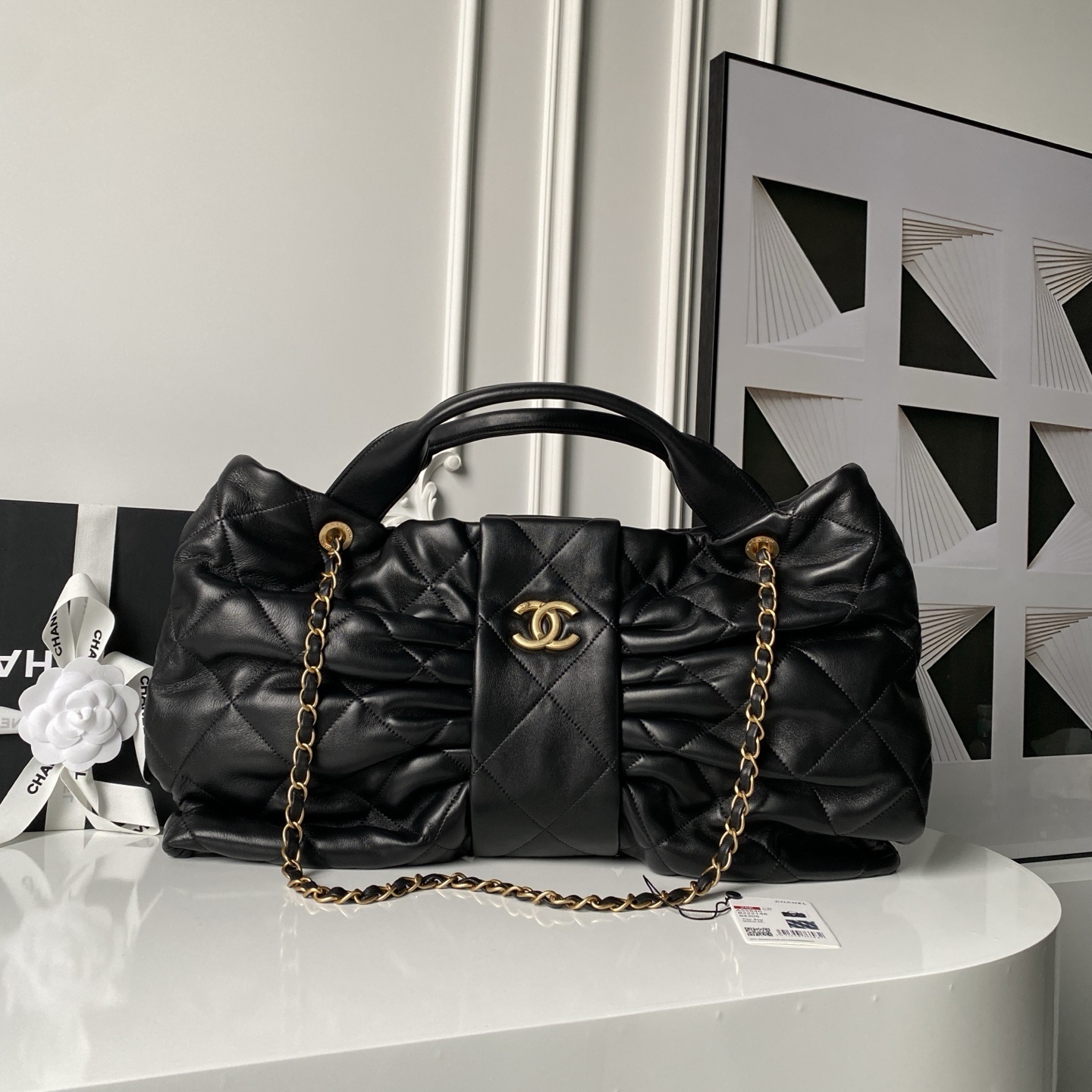 Chanel Mini Bow Bag in black shiny lambskin with gold-tone metal hardware
