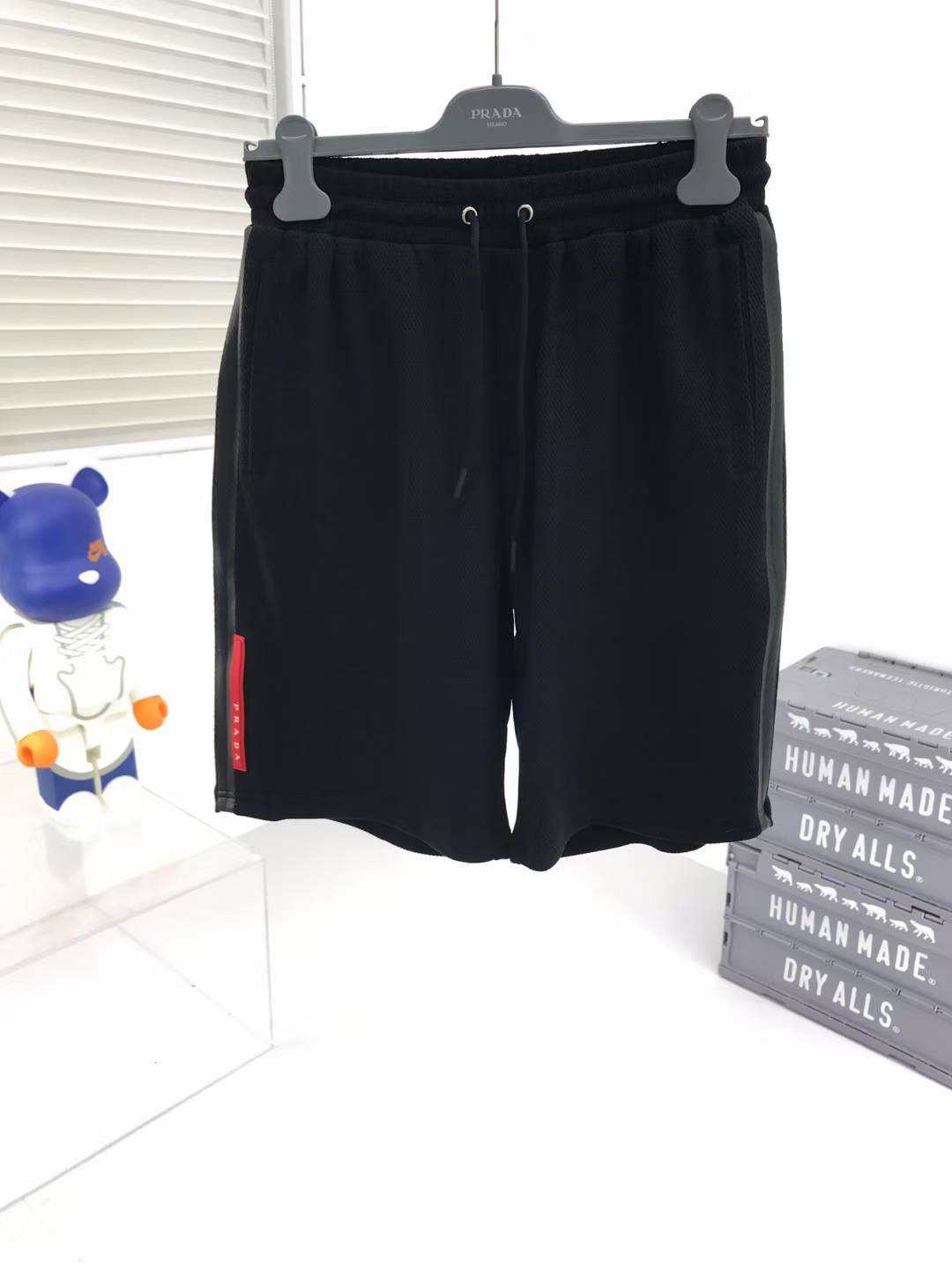 Prada Re-Nylon shorts with a drawstring waist and enameled metal triangle logo