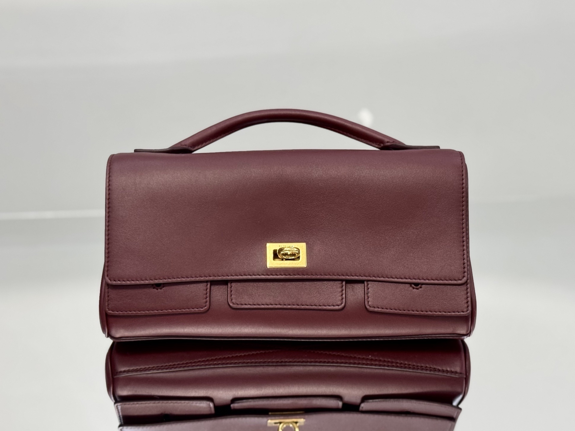 Balenciaga Bel Air Hobo Bag in smooth calfskin leather and a burgundy color