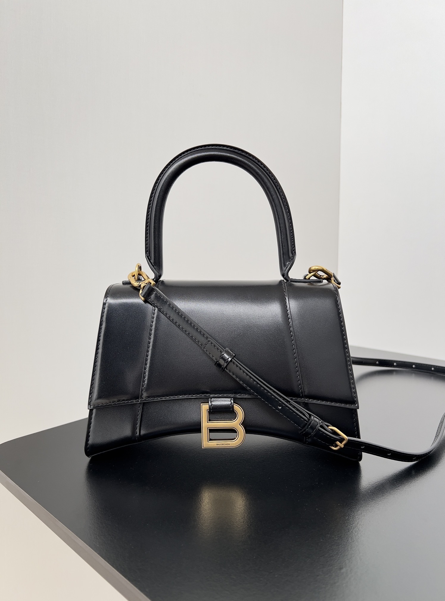 Balenciaga Hourglass Small top-handle bag in black smooth calfskin leather with gold-tone hardware
