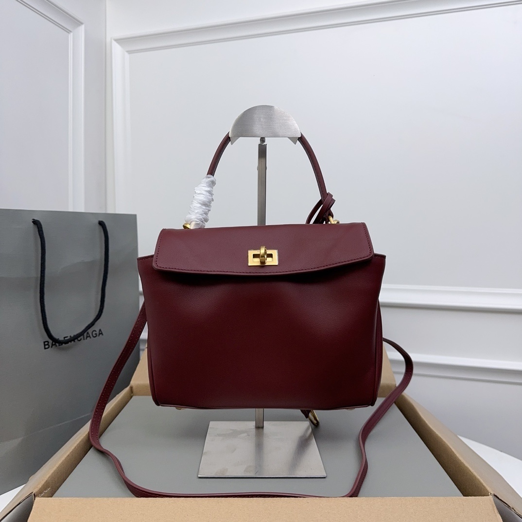 Balenciaga Rodeo medium leather tote bag in a dark burgundy color