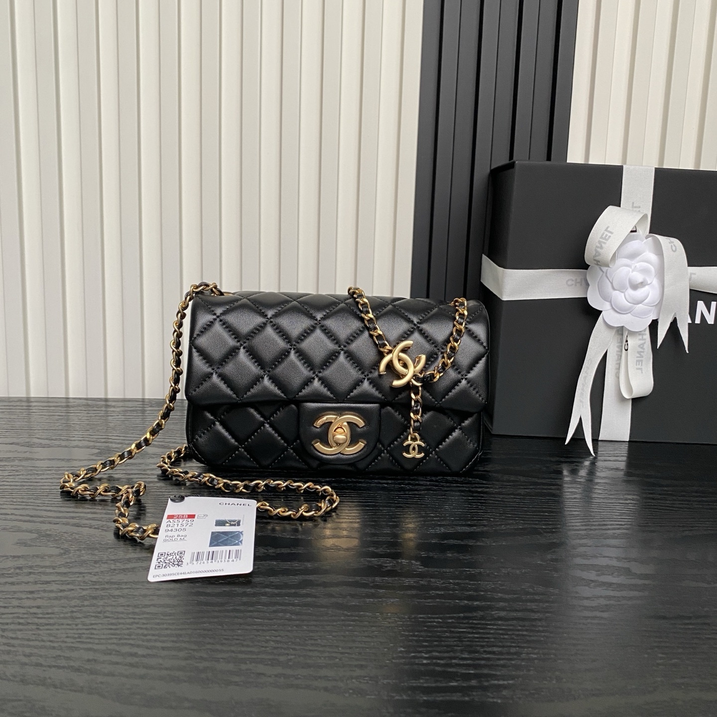 Chanel Mini Flap Bag in black lambskin with gold-tone hardware