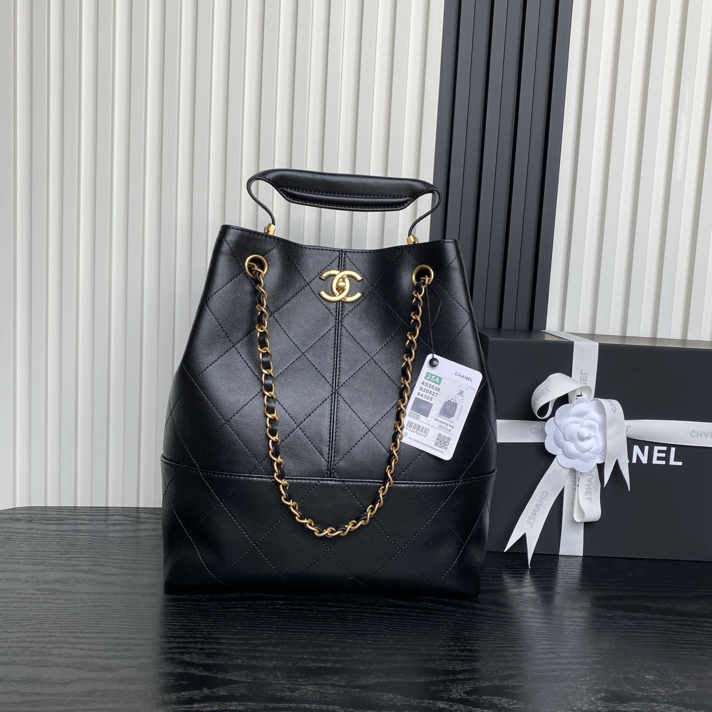 Chanel 25 hobo shopping bag in black calfskin with gold hardware