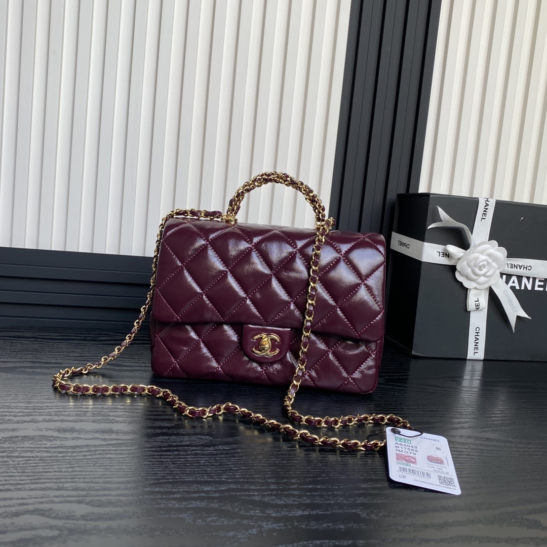 Chanel 24B Twist Handle Flap Bag in a wine red or burgundy quilted leather finish.