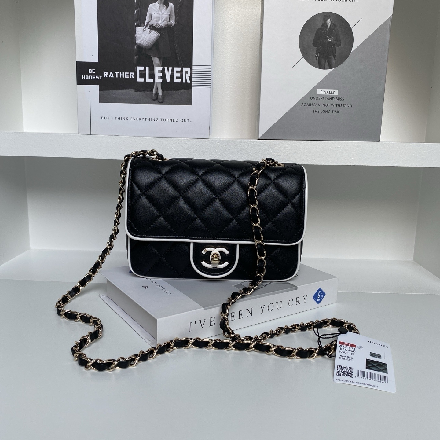 Chanel Small Graphic Frame Flap Bag in black lambskin leather with light gold tone hardware and contrast white leather edge piping