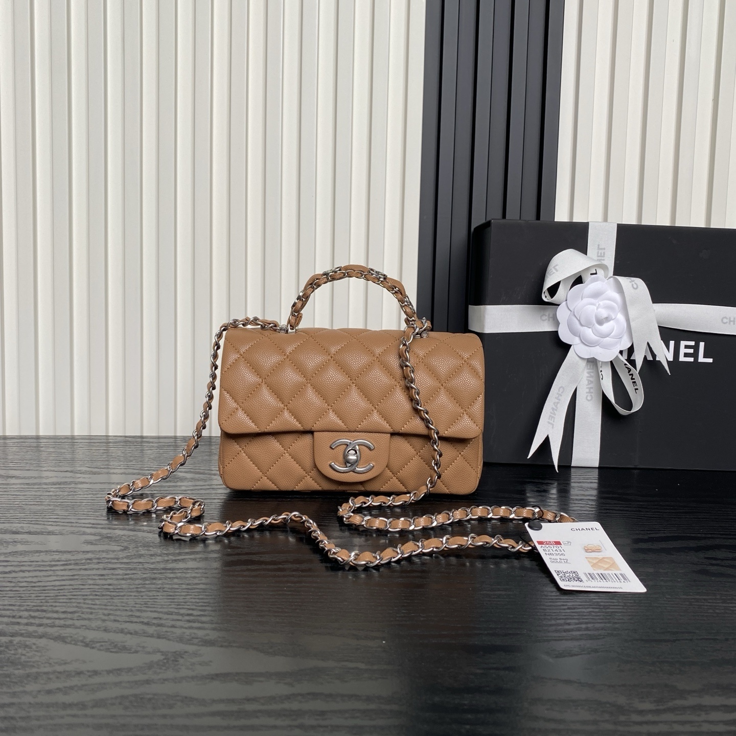 Chanel Mini Rectangular Flap bag with a top handle in caramel quilted lambskin leather and light gold-tone hardware
