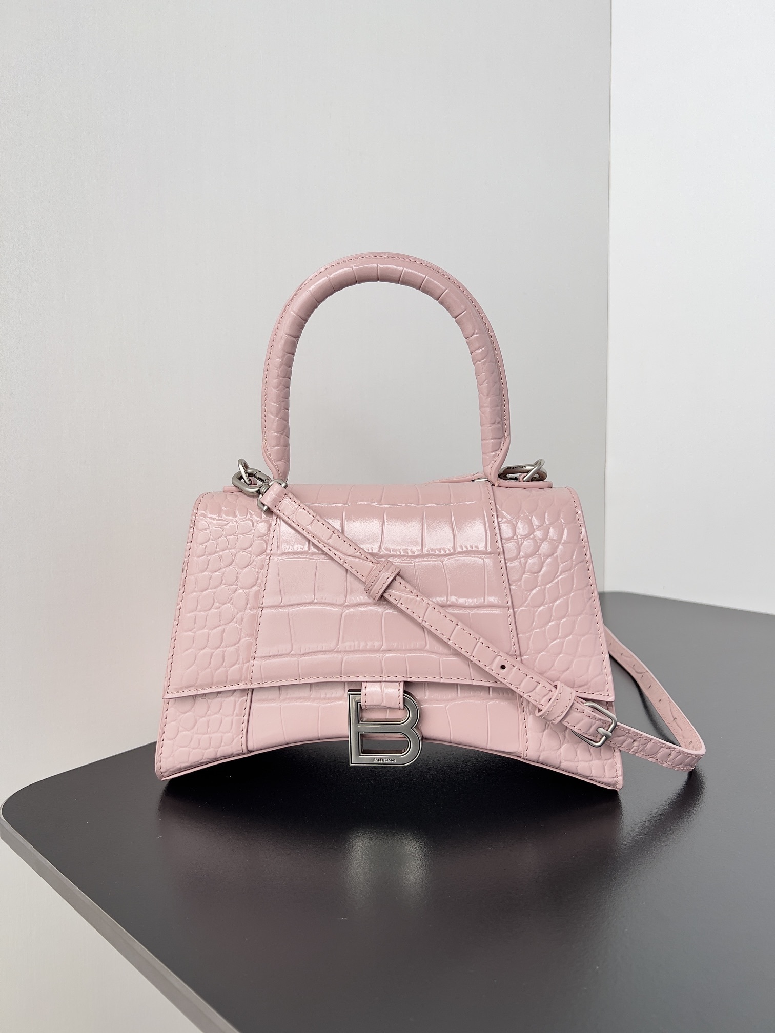 Balenciaga Hourglass Small top handle bag in pink shiny crocodile-embossed calfskin leather with aged-silver hardware