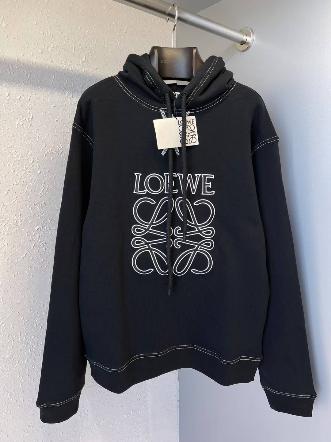 Loewe Anagram cropped cotton-fleece hoodie in black with white contrast stitching