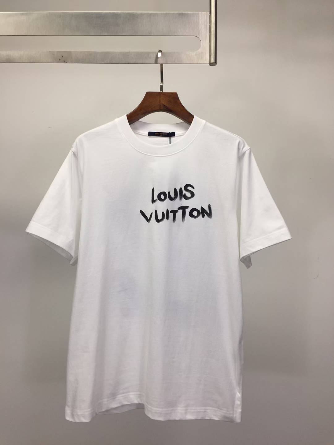 LV cotton T-shirt with a black script logo.