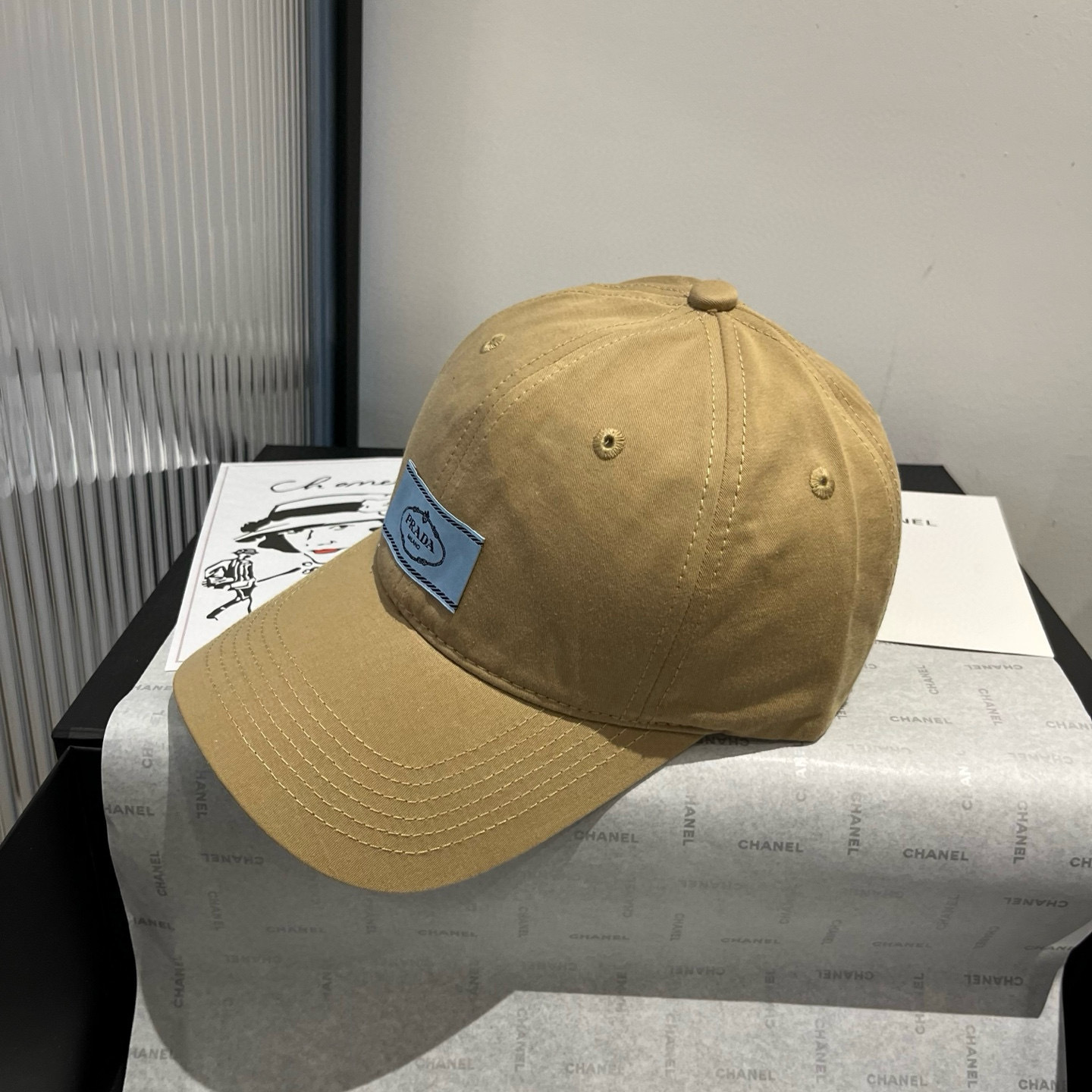 Prada beige cotton baseball cap with a light blue Prada logo patch