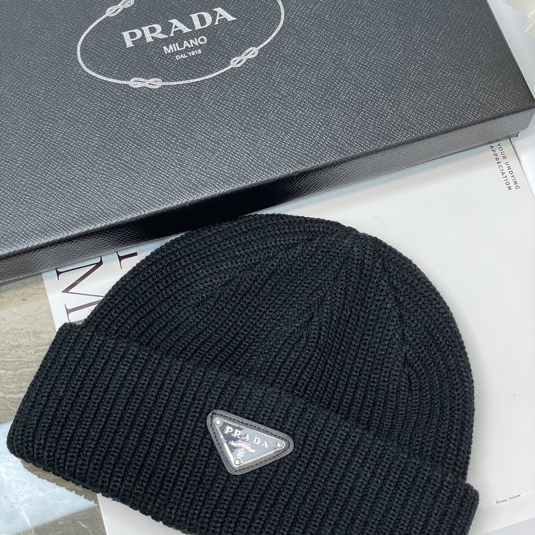 Prada ribbed-knit beanie virgin wool and cashmere with a signature enameled metal triangle logo