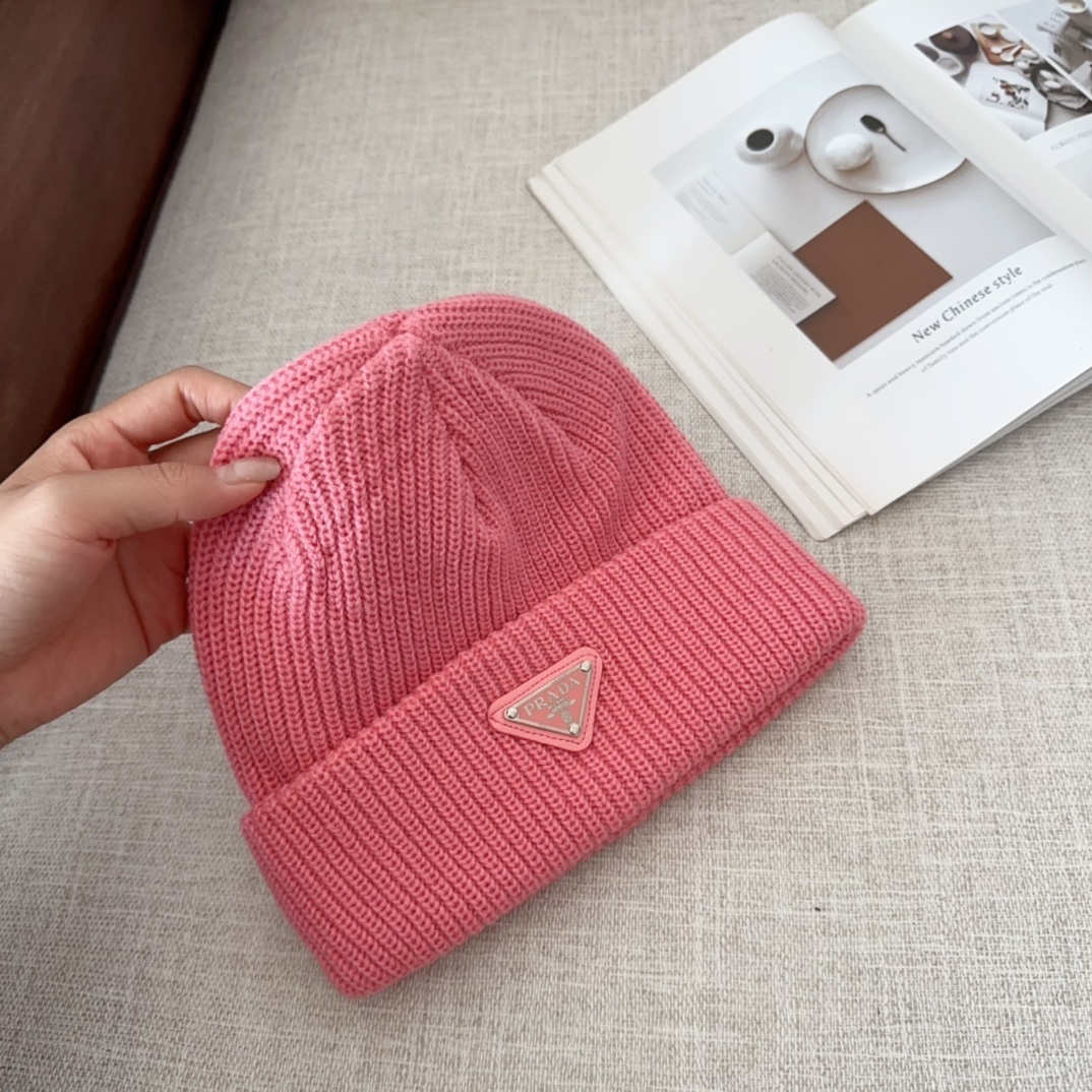 Prada triangle-logo ribbed beanie hat in pink wool and cashmere