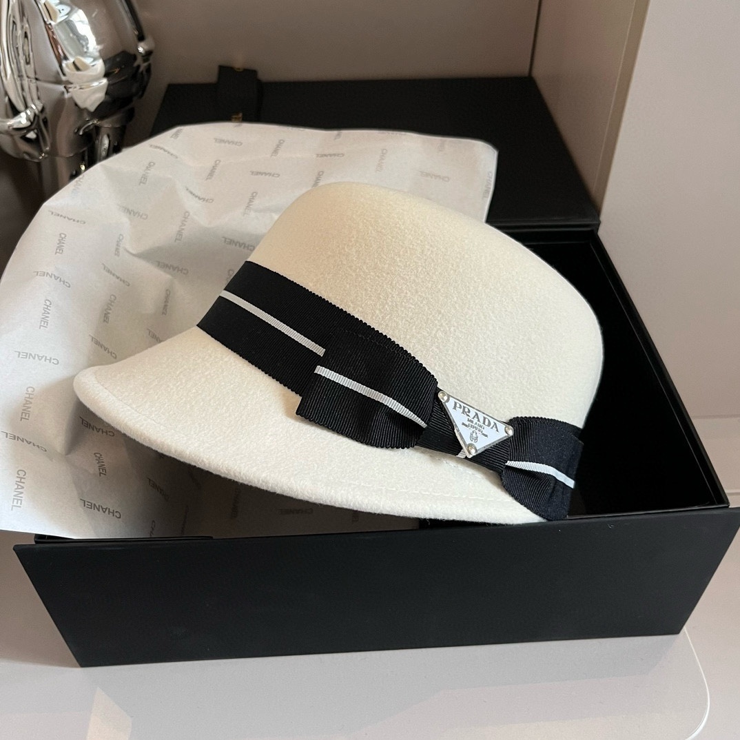 Prada beige straw hat with a black band