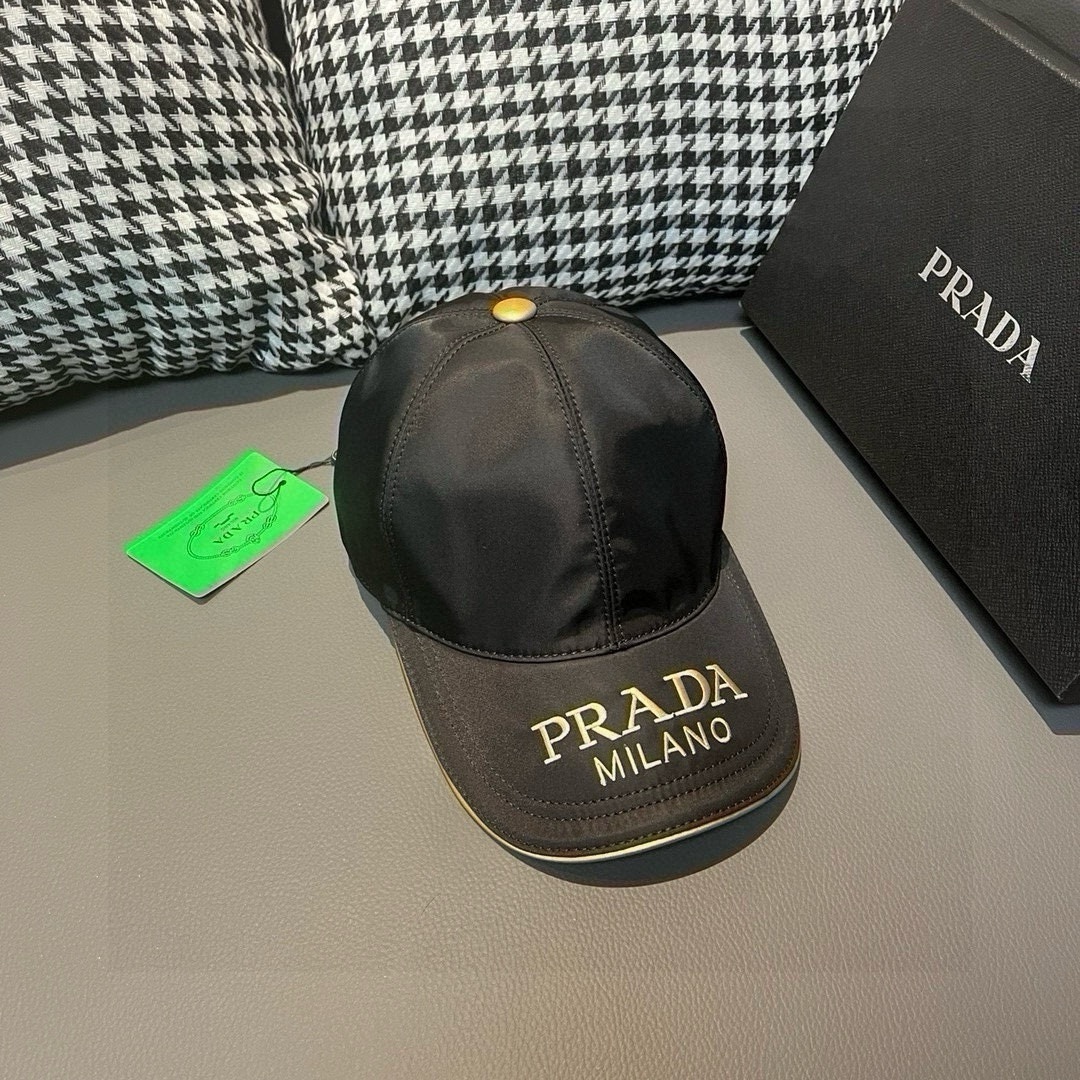 Prada Milano baseball cap in black fabric with a gold embroidered logo and detailing