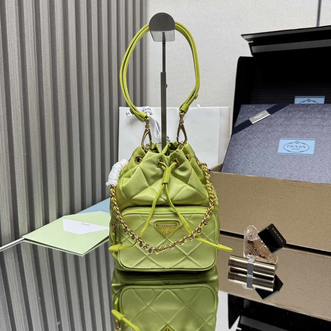 Prada Re-Nylon bucket bag in a lime or light green color