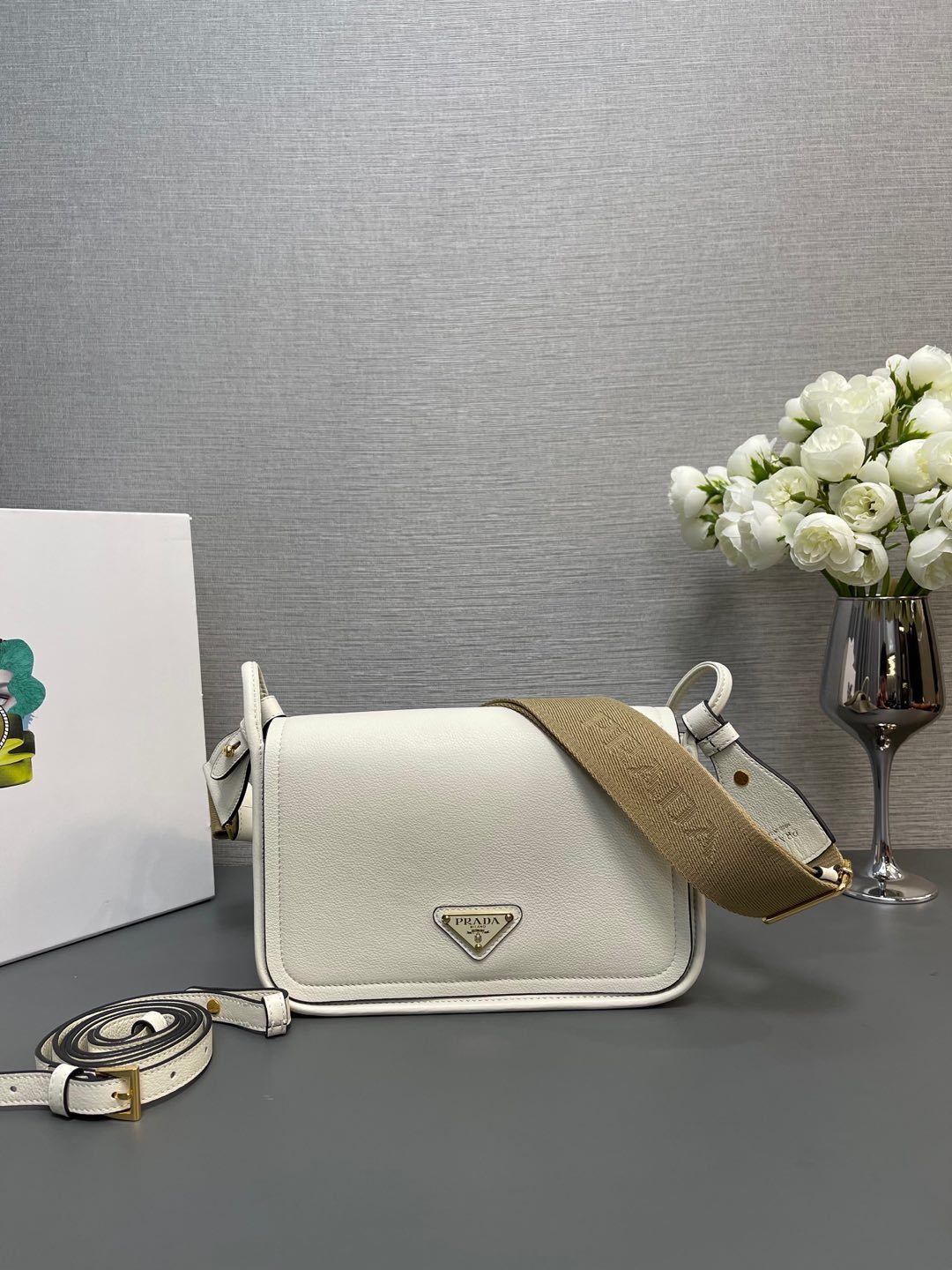 Prada leather shoulder bag with a detachable logo-jacquard fabric strap