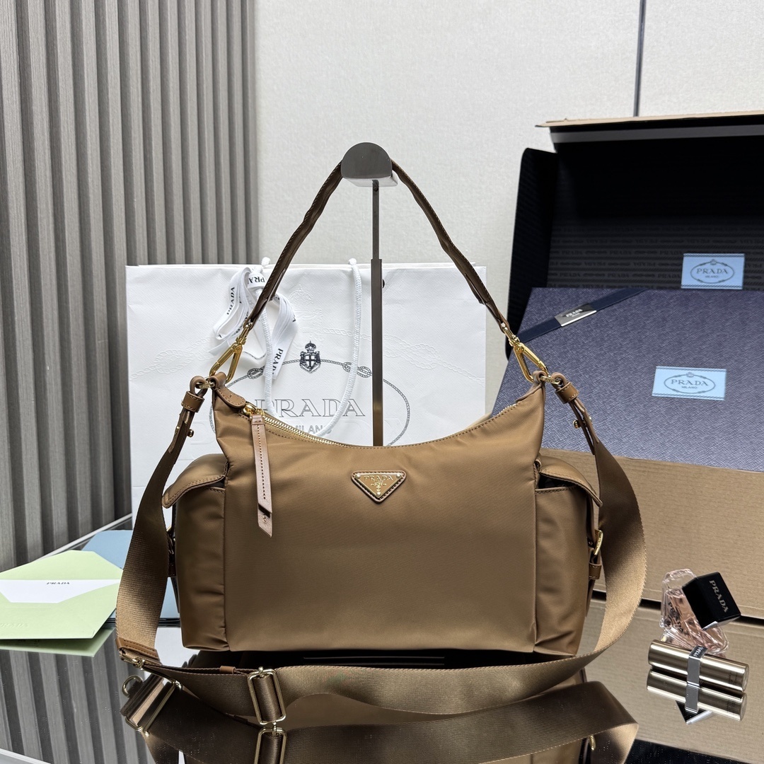 Prada Explore Re-Nylon and leather bag in a brown (likely brandy or cinnamon) color