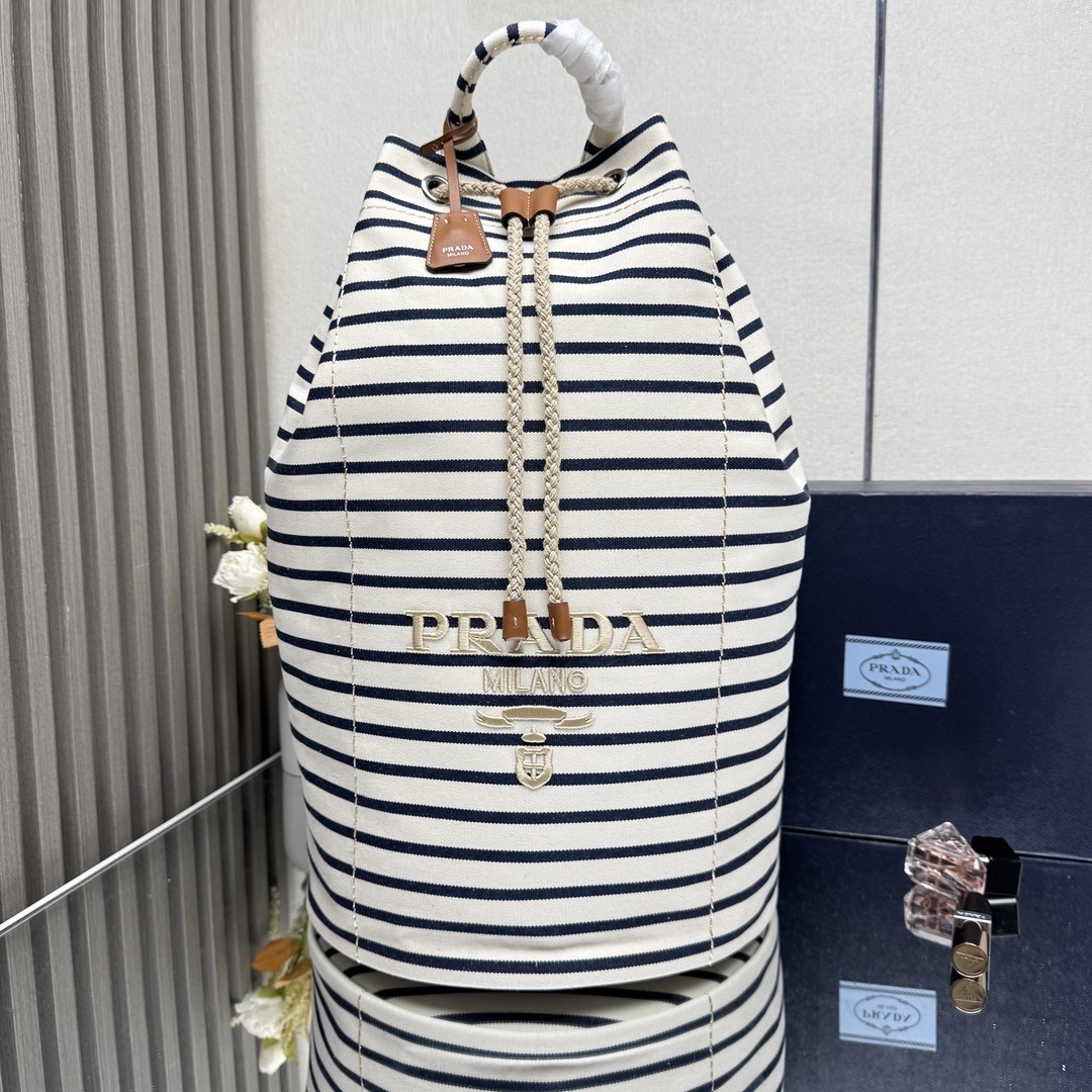 Prada striped canvas drawstring duffel bag in ivory and blue