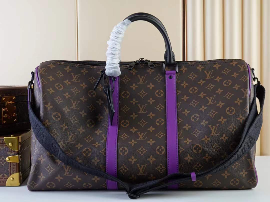 LV Keepall Bandouliere 50 travel bag in Monogram canvas with black and purple leather trim