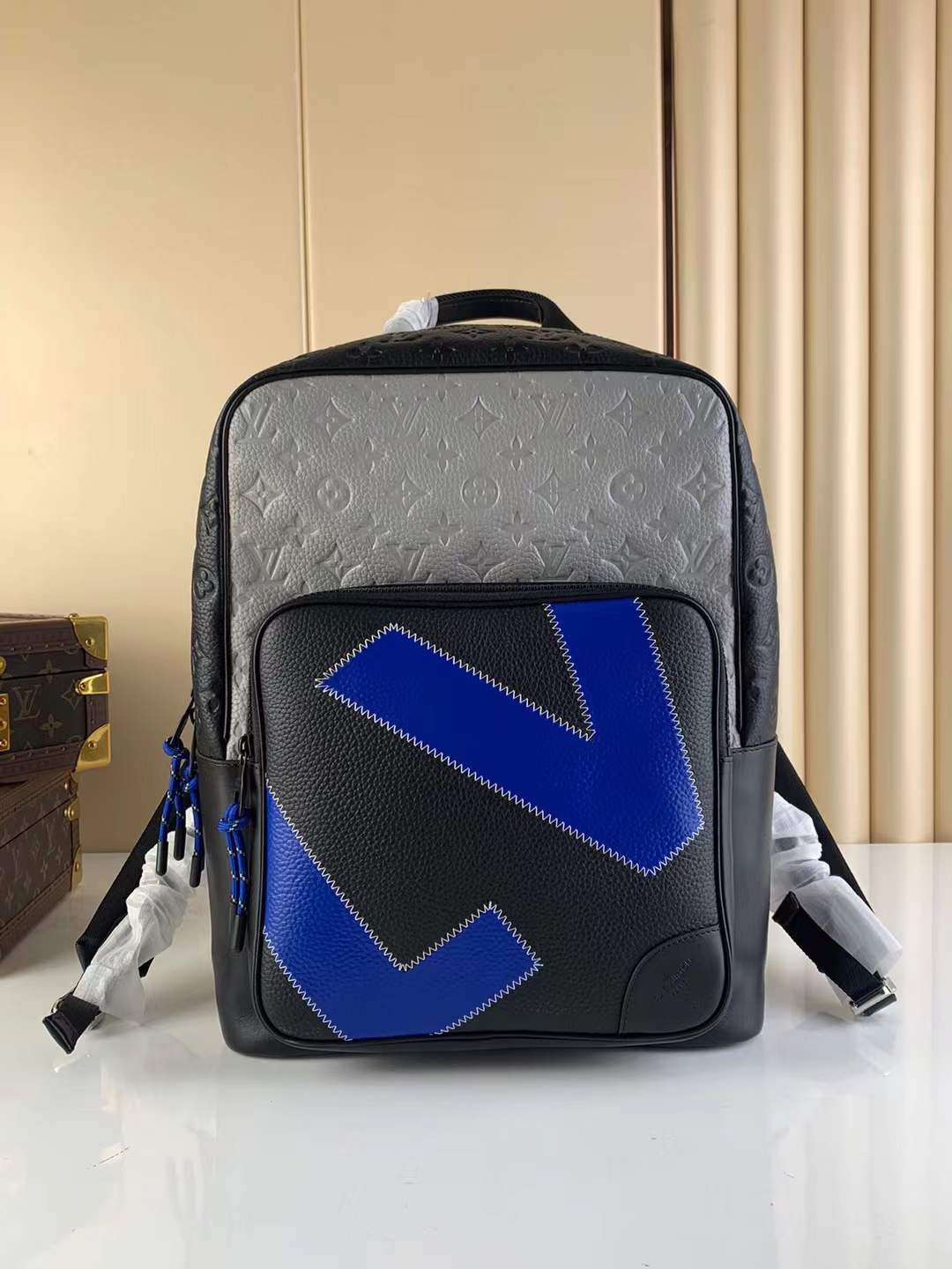 LV Dean Backpack made from a mix of black and blue Taurillon leather