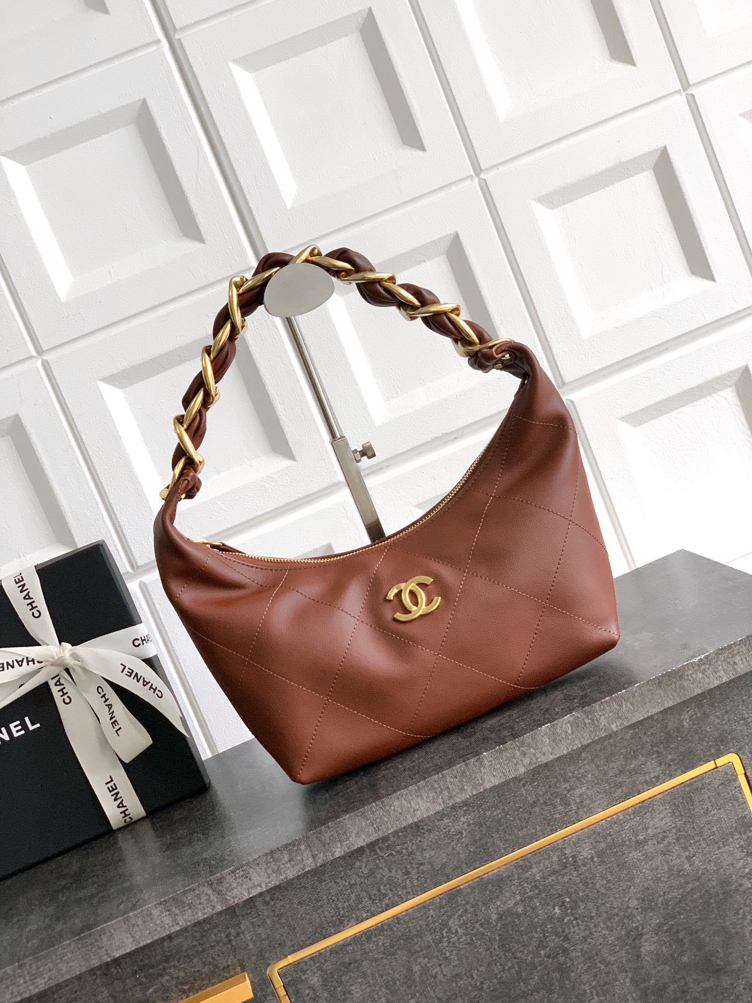 Chanel hobo bag in a brown or caramel leather with a gold-tone chain strap