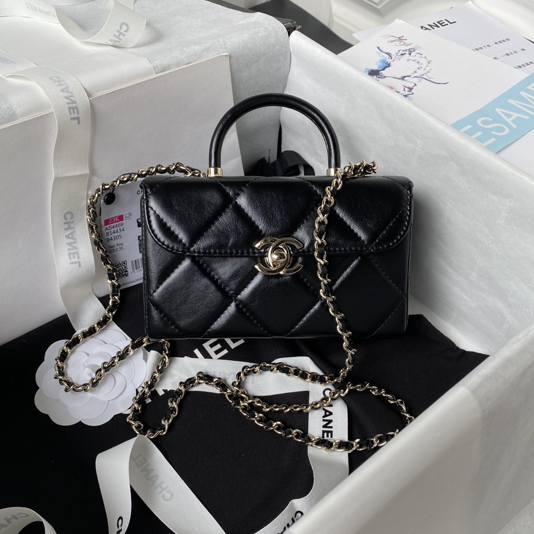 Chanel mini flap bag with top handle in black lambskin