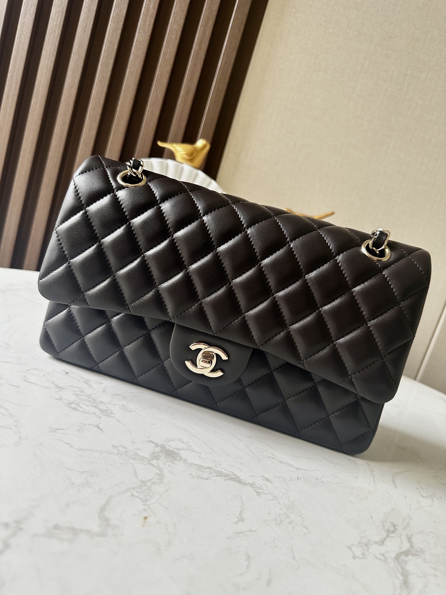 Chanel Classic Flap bag in black quilted lambskin leather with gold-tone hardware
